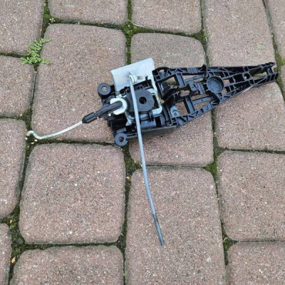 Podstawa klamki drzwi przód przednia lewa EUROPA cięgno Opel Adam