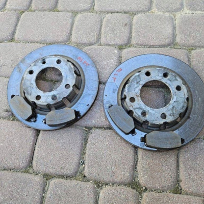 Tarcza tył tylna hamulcowy + klocki ORYGINAŁ 1.2i HN05 tylna Opel Astra L