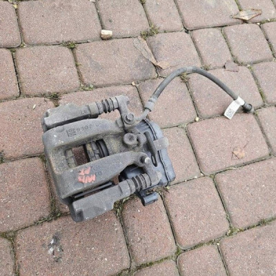 Zacisk tył tylny prawy zaciskowy jażmo 4x4 Opel Insignia B