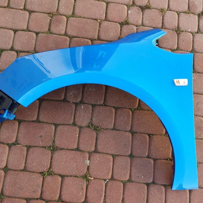 Błotnik przedni lewy Opel Astra J 4 IV Z22u GTC