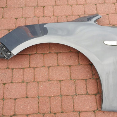 Błotnik przód lewy Opel Astra J 4 IV Z190