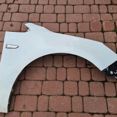 Błotnik przód przedni prawy Opel Astra J IV