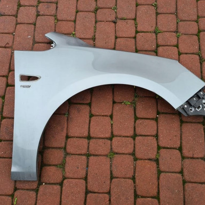 Błotnik przód przedni prawy Opel Astra J IV 4