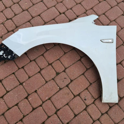 Błotnik przód przedni prosty lewy Opel Astra J IV