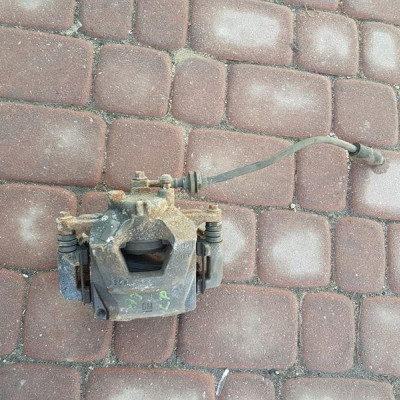 Zacisk przód przedni lewy Opel Astra J IV