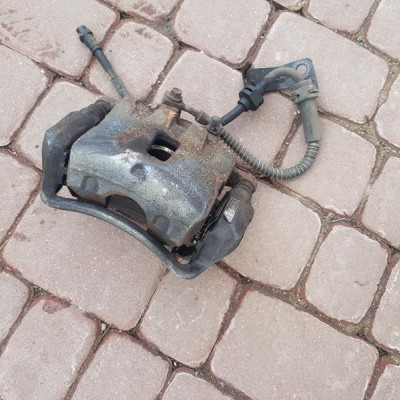 Zacisk przód przedni lewy Opel Astra J IV 13229151