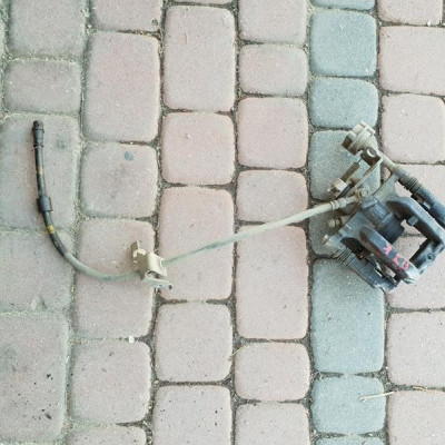 Zacisk tył lewy Opel Astra J IV Zafira C 13467357