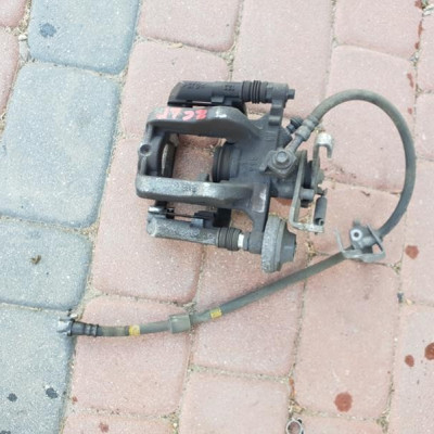 Zacisk tył tylny lewy jażmo Opel Zafira C Astra J