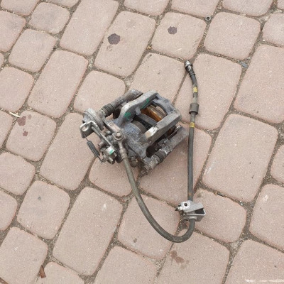 Zacisk tył tylny lewy Opel Astra J IV