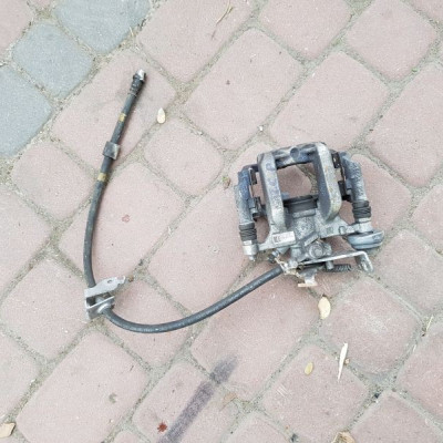 Zacisk tył tylny Opel Astra J IV Fi 292