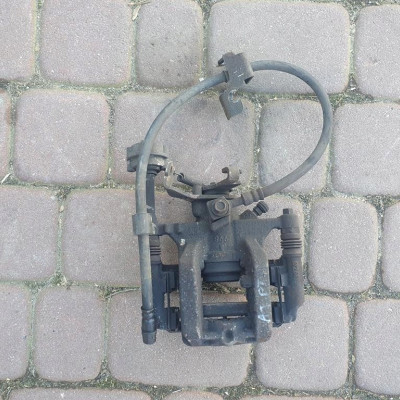 Zacisk tył tylny prawy jażmo Opel Astra J IV