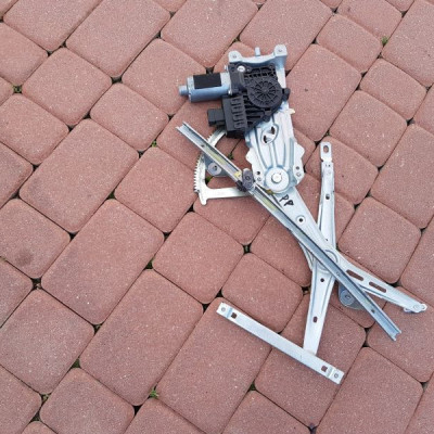 Podnośnik szyby przód przedni Opel Astra H kombi