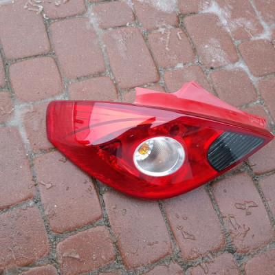 Lampa lewy tył Opel Corsa D 13211840