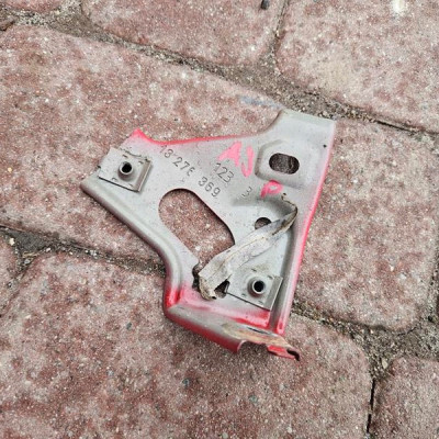 Wspornik błotnika prawy uchwyt mocowanie Opel Astra J IV 13276369