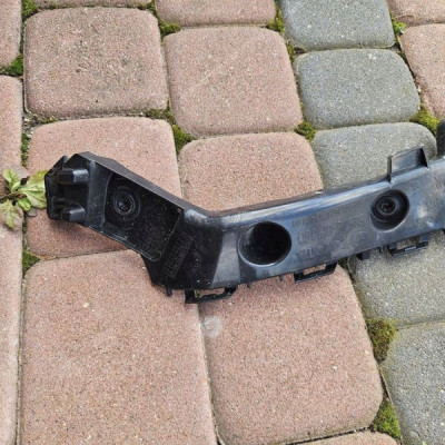 Uchwyt mocowanie wspornik zderzaka ślizg tył lewy Toyota Aygo X 52575-0H050